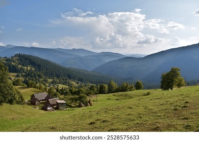 Landscape with a small farm among the mountains. - Powered by Shutterstock