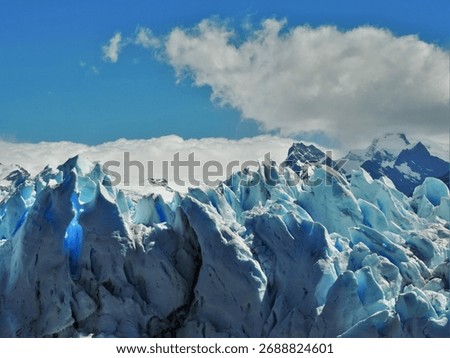 A landscape of a snowy hill with sharp formations of ice