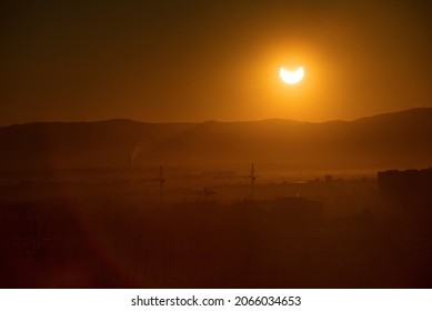 Landscape with a solar eclipse on the background 