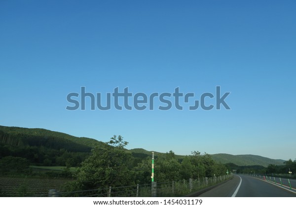 Landscape of summer\
roadside in Hokkaido,\
Japan