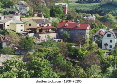 Landscape summer sunny view of a small village in the valley. Kamenets Podolsky. Ukraine.