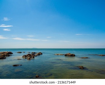 Landscape Summer  View Blue Sea Calm Wave. Wind Blows Cool And Still, See Rocks Distance, Still See  Sky Clear, Look Relaxed. Suitable Relax And Travel