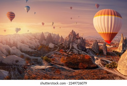 Landscape sunrise with hot air balloons fly over deep canyons, valleys Cappadocia Goreme National Park Turkey, aerial top view. - Shutterstock ID 2249726079