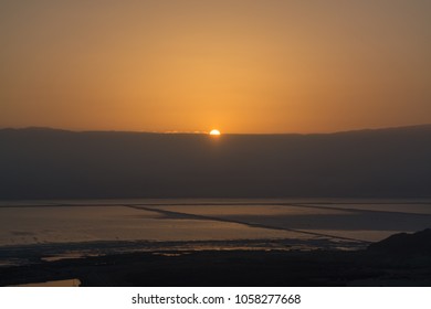 Landscape With Sunrise Over Dead Sea, Full Of Minerals Near Town Ein Bokek, Place For Medical Treatments, Climatotherapy, Thalassotherapy, Heliotherapy