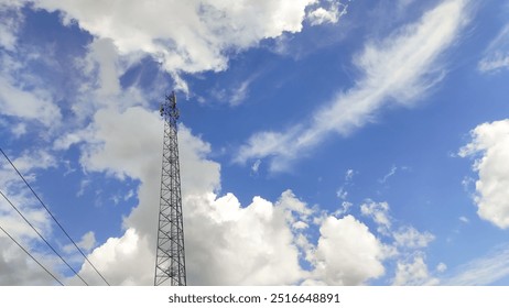 Landscape Telecommunications tower with background of dense clouds and clear blue sky. Technology telecommunication industry mobile .Industry Telecommunications. Network Connection background - Powered by Shutterstock