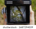 landscape through the viewfinder of the vintage TLR (Twin lens reflex) camera.