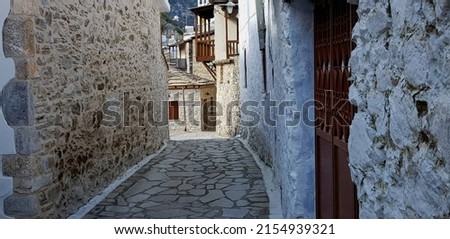 Landscape with traditional rural stone built houses on the cobblestone streets of  Kastanitsa in Arcadia Peloponnese, Greece.