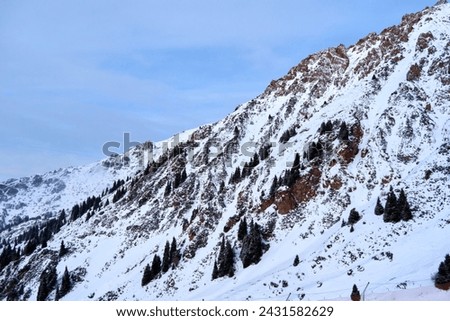 Landscape in Trans-Ili Alatau on a winter day. 
Trans-Ili Alatau is a part of the Northern Tian Shan mountain system. Kazakhstan.  Almaty.
