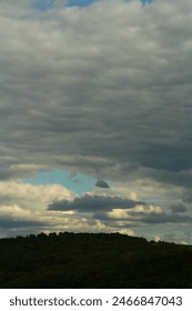 A landscape with trees and clouds