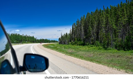 Landscape Of Trees And Mountains  From Car In Northern Quebec