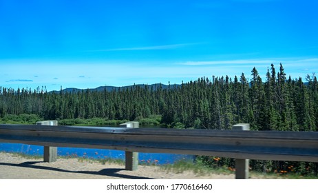 Landscape Of Trees And Mountains  From Car In Northern Quebec