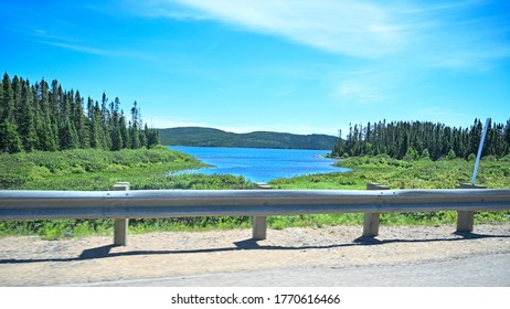 Landscape Of Trees And Mountains  From Car In Northern Quebec