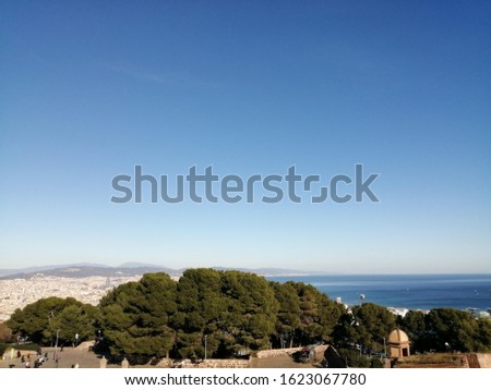 Similar – Panorama von Barcelona mit Büschen im Vordergrund und Sagrada Familia