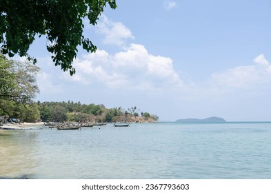 landscape at tropical ocean sea shore bank with calm sea ocean bay and many boats under sunshine cloudy background.tropical harbour landscape with blue sky and white cloud background - Powered by Shutterstock