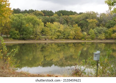 A Landscape Of Tuttle Creek Lake Surrounded By Greenery Under A Cloudy Sky In Kansas, The US