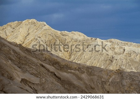 Landscape of two hills with different lighting.