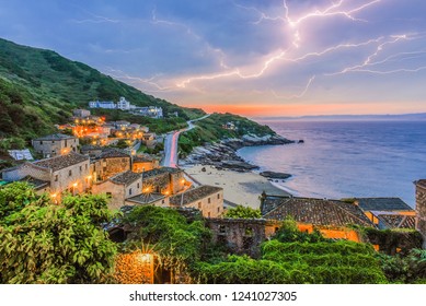 Landscape View of Chinbe (Qinbi) Village With Traditional Fujian Stone Houses And Thunder Lightning At Sunset, Matsu, Taiwan