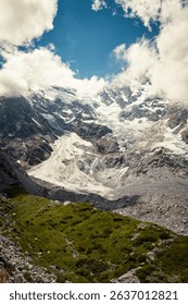 A landscape view of the clouds shadow over the mountain peaks