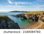 A landscape view of  the coast of  cardigan  bay with the island in the distance  in West Wales