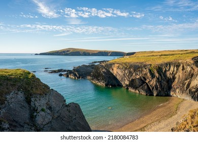 A landscape view of  the coast of  cardigan  bay with the island in the distance  in West Wales - Shutterstock ID 2180084783