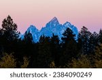 Landscape view during sunset of Middle Teton, Grand Teton and Mount Owen from the Bridger Teton National Forest in Wyoming
