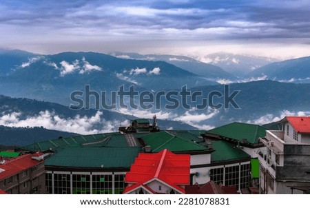 Landscape View of Hill Station Buildings with Mountain Layers.