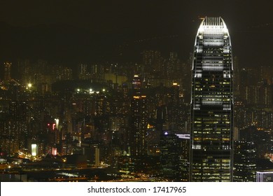 Landscape View Of Hong Kong At Night Showing IFC2 Set Against A Background Of City Skyscrapers. Batman Base Jumped From This Building In A Recent Film.