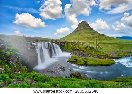 landscape view of Kirkjufellsfoss In the daytime, blue sky and beautiful clouds. The waterfall is famous and a popular tourist spot in Iceland.