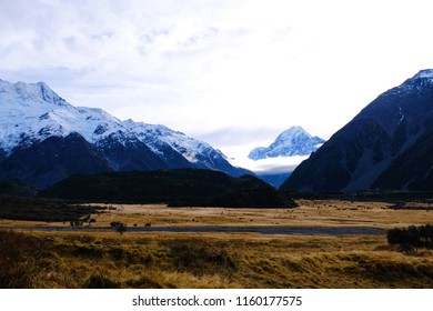 Landscape View Mountain And Road With Brown Filed In Autumn At Aroki Mt.cook