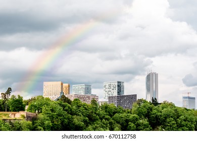 Landscape View On The Modern Business District In Luxembourg City With Rainbow In The Sky