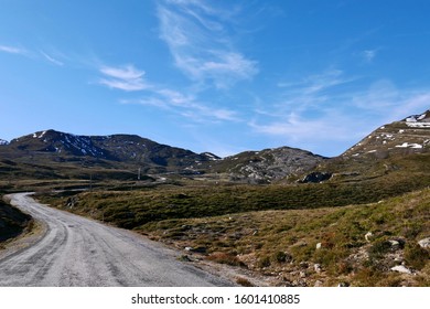 Landscape View On Mountains Near Burgos In Spain, In December. Sunny Cold Day. Country Road Winding Uphill. Baron Land.