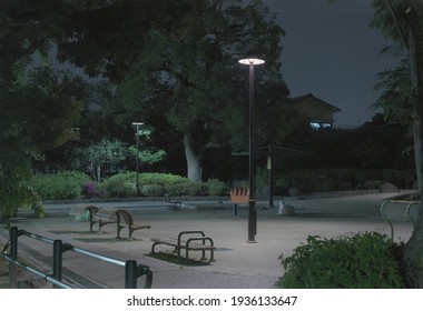 Vue panoramique d'un parc à Toyko la nuit sans personne, un réverbère illumine les bancs vides.