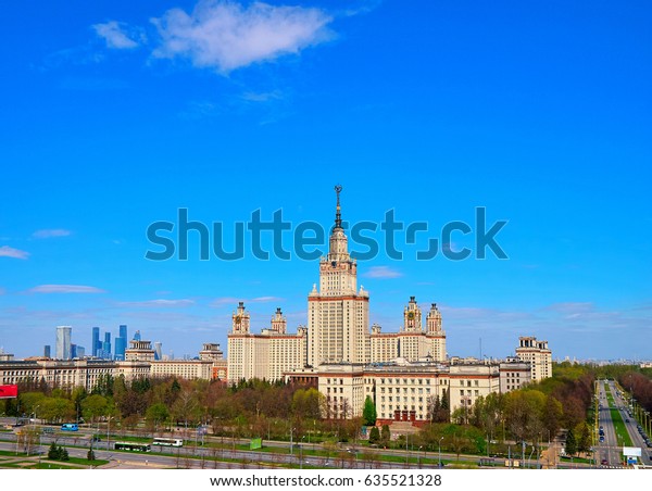 A landscape view of the
sunny spring campus of Lomonosov Moscow State University under blue
cloudy sky