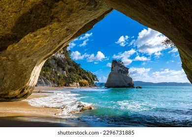 Landscape View through rock arch towards Te Hoho Rock at Cathedral Cove, Coromandel Peninsula - New Zealand - Powered by Shutterstock