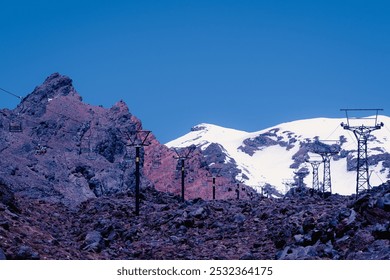 Landscape view of Tongariro National Park from cable car riding, Taupo, North Island, New Zealand: volcanic rock, waterfall, town center of Taupo and Mount Ruapehu. - Powered by Shutterstock