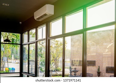 Landscape view from the window for relaxing time, green nature beside the window, coffee bar, peaceful place for take a rest in the morning, Flare light through the window in the morning - Powered by Shutterstock