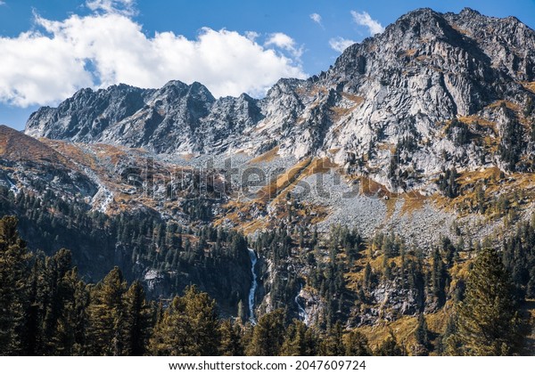 Landscape with a waterfall of peak at Altai\
nature reserve