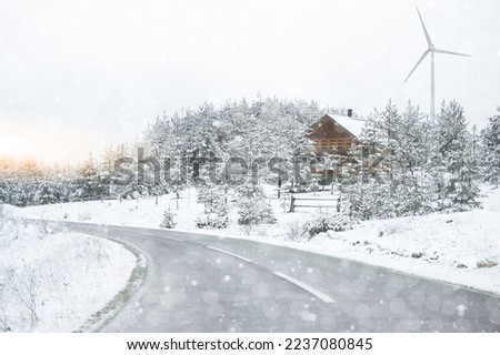 landscape with windmill in winter