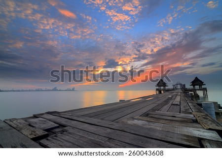 Landscape of Wooded bridge in the port between sunrise.Chonburi Thailand