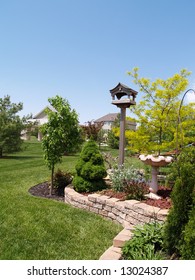 Landscaped Back Yard With Blue Sky In The Background