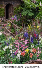 Landscaped Backyard Flower Garden Of Old House 
