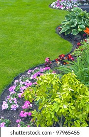 Landscaped Yard And Garden. A Beautiful Landscaped Yard And Garden With A Variety Of Perennials And Annuals.