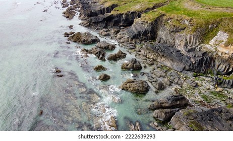 Landscapes On The Wild Atlantic Way, Ireland. Natural Attractions Of Northern Europe. Coastal Cliffs Of The Atlantic Ocean. Stone Reef And Sea Water. View From Above.