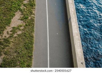 Landscaping on the riverbank, geometric separation of water and shore view from above. - Powered by Shutterstock