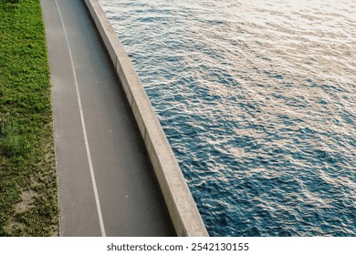 Landscaping on the riverbank, geometric separation of water and shore view from above. - Powered by Shutterstock