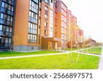 Landscaping for urban spaces. Modern Front Yard. Lawn at entrance of residential building. Modern complex of multi-apartment residential buildings. New apartment facade building. Landscaping at home.