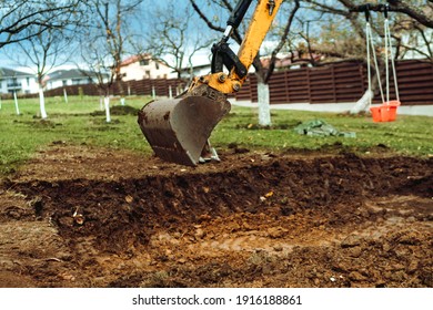 Landscaping Works With Bulldozer And Excavator At Home Construction Site. Terrain Works	