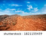 Landscpae of rocky red Desert over blue sky 