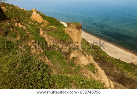 Landslide on Black Sea coast. Zone of natural disasters during rainy season. Large masses of earth slide along slope of hill, destroy houses. Landslide - threat to life