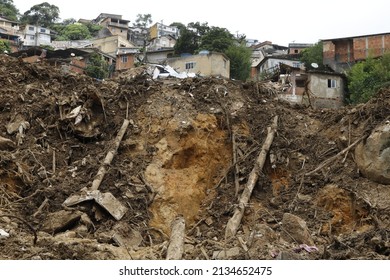 Landslide in Petropolis city,  natural disaster destroyed house, mud and debris. Firefighters teams working search and rescue for victims of rain at Morro da Oficina. Rio de Janeiro, Brazil 02.25.2022